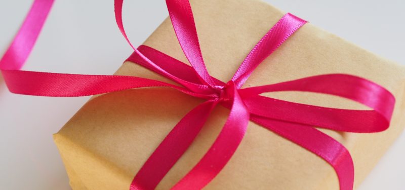 present with red ribbon and brown wrapping