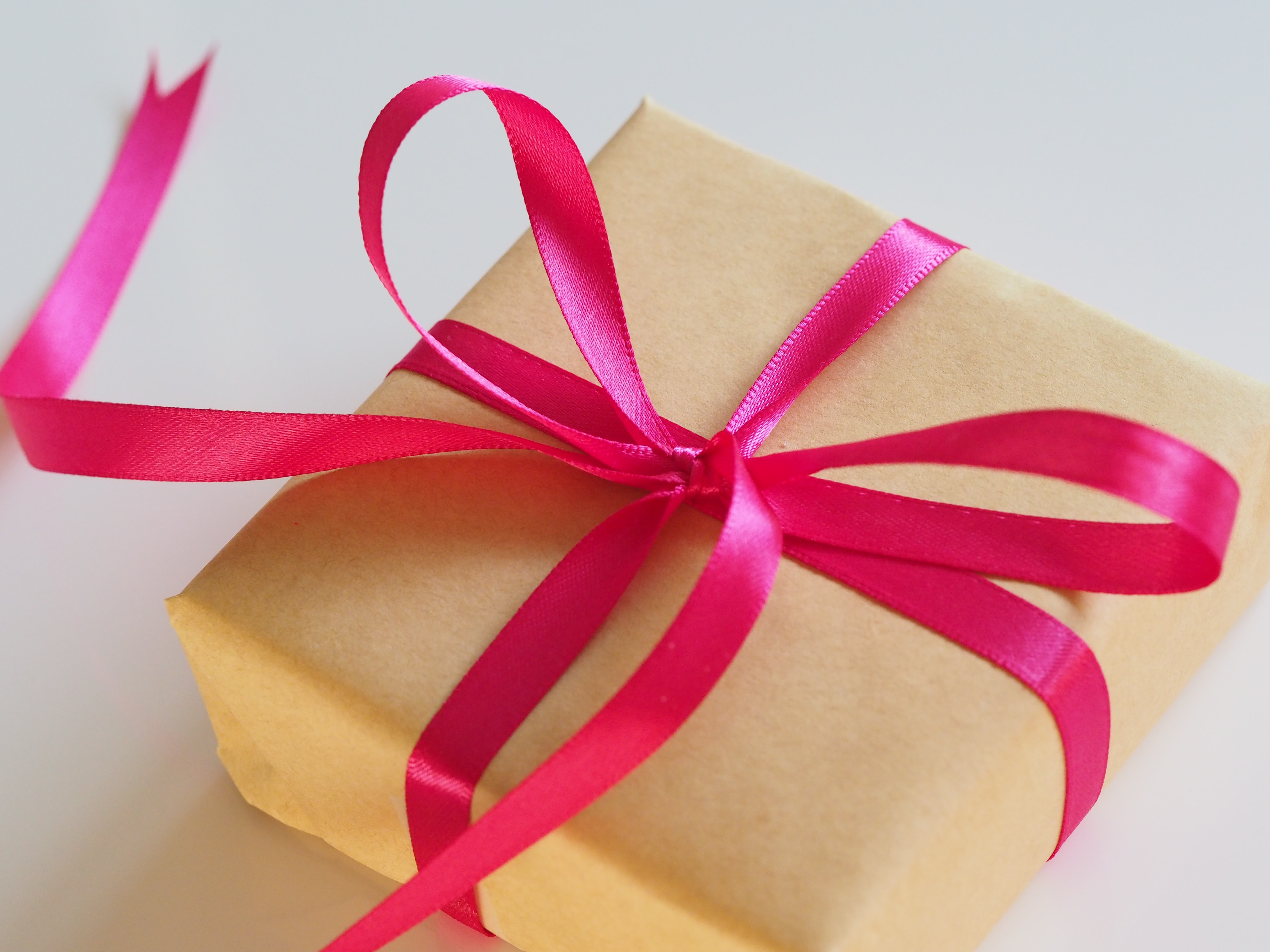 present with red ribbon and brown wrapping