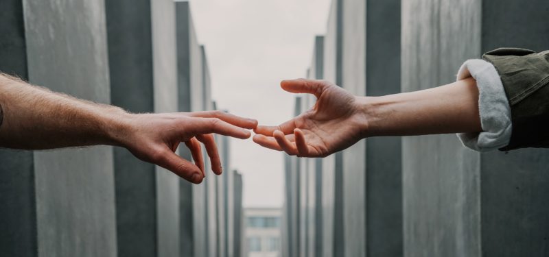 Helping hands accross high rise buildling